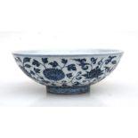 A Chinese blue and white footed bowl decorated foliate scrolls 29cm wide