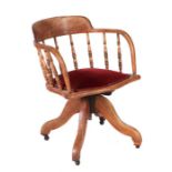 An early 20th Century oak swivel desk chair