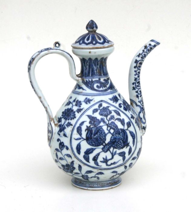 A Chinese blue and white ewer decorated fruit and foliage 27cm high