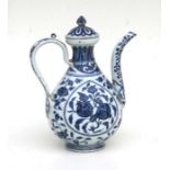 A Chinese blue and white ewer decorated fruit and foliage 27cm high