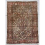 A Persian Meshkin hand knotted woollen rug with central floral medallion within floral borders, on a