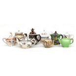 A large quantity of teapots to include Doulton, Satsuma, Bargeware and Saddler examples.