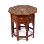 An Islamic octagonal inlaid hardwood table, 46cms wide.Condition ReportThe inlaid area to the top