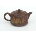 A Chinese Yixing pottery teapot decorated with figures and calligraphy, impressed seal mark to the