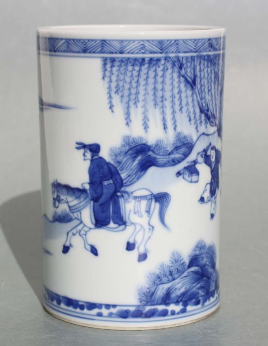 A Chinese blue and white bitong/brush pot decorated figures in a landscape, 14cm high