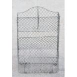 A wirework three-tier vegetable rack, 45cms wide.Condition ReportThe vegetable rack has some general