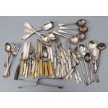 A quantity of silver cutlery to include sugar tongs, London 1831, and salad servers, London 1923,