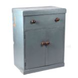 A painted pine chest with single drawer above two panelled doors enclosing a shelved interior, 76cms