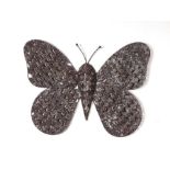 A distressed metal garden wall hanging in the form of a butterfly, 54cms wide.