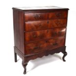 A walnut chest of two short and three graduated long drawers, on cabriole legs (looks to be period