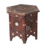 A Moroccan / Islamic carved hardwood hexagonal table, 46cm wide