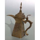 An Indo Persian brass dallah coffee pot, 28cm high