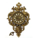 A late 19th / early 20th century Cartel wall clock with brass gilded lacquered case, a brass dial