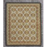 A Caucasian hand knotted woollen rug with repeating geometric design on a yellow ground, 168 by