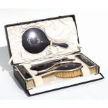 A ladies six-piece silver and tortoiseshell dressing table set, Birmingham 1925, cased.