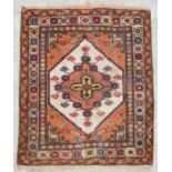 An Iranian Sarouk Jozan woollen hand knotted rug, the central medallion within floral borders, on