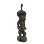 African Art / Tribal Art: A Songye power figure, perforated holes throughout, medicine bundle and