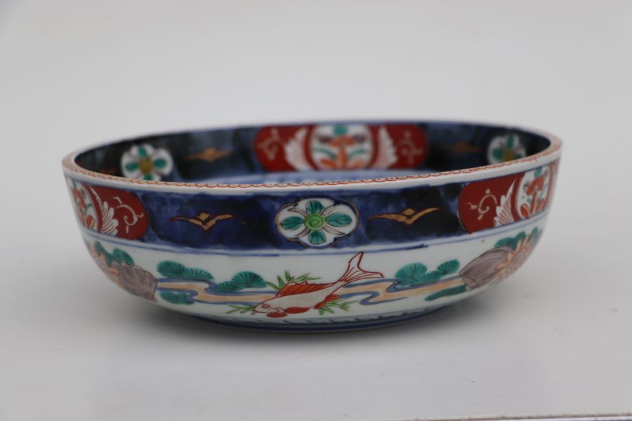 A Japanese Imari bowl decorated with birds in a river landscape, 25cms diameter together with a pair - Bild 13 aus 16