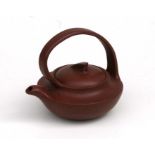 A Chinese Yixing pottery tea pot with impressed seal mark to the underside, 11cm high Condition