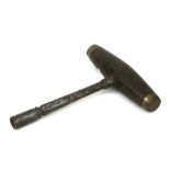 A 19th century steel and hardwood piano tuning key. 15cms high.