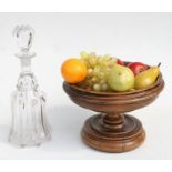 A treen footed bowl, 28cms diameter; together with a selection of faux fruit and a Georgian style