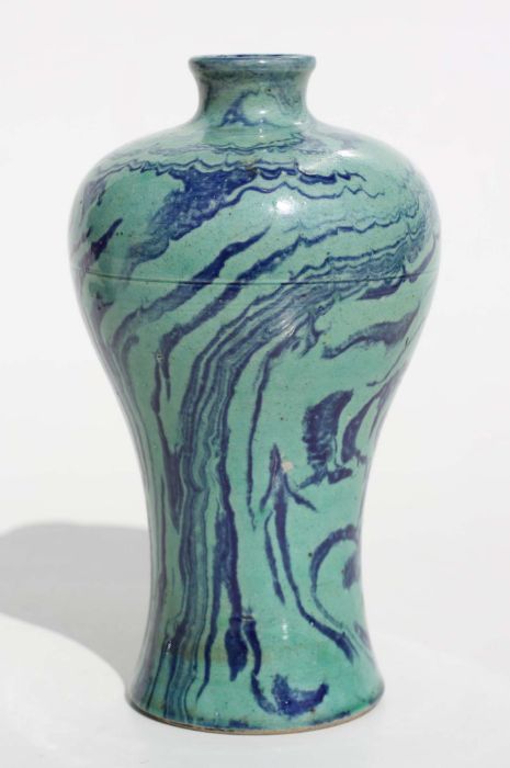 A Chinese marbled green and blue glaze meiping vase, 15cm high Condition ReportThere are a couple of