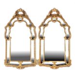 A pair of George III style carved giltwood wall mirrors, each 70cms wide (2).