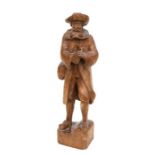 A German carved wooden figure of a bearded gentleman, 53cms high.