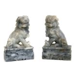 A pair of carved soapstone dogs of fo, each 18cms high (2).