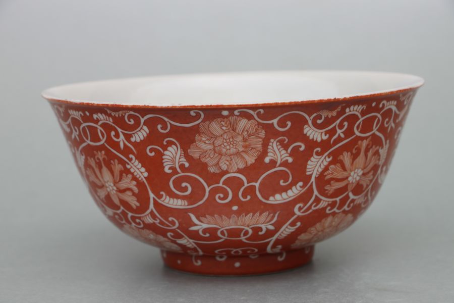 A Chinese footed bowl decorated with scrolling flowering foliage on a burnt orange ground, six - Image 7 of 7