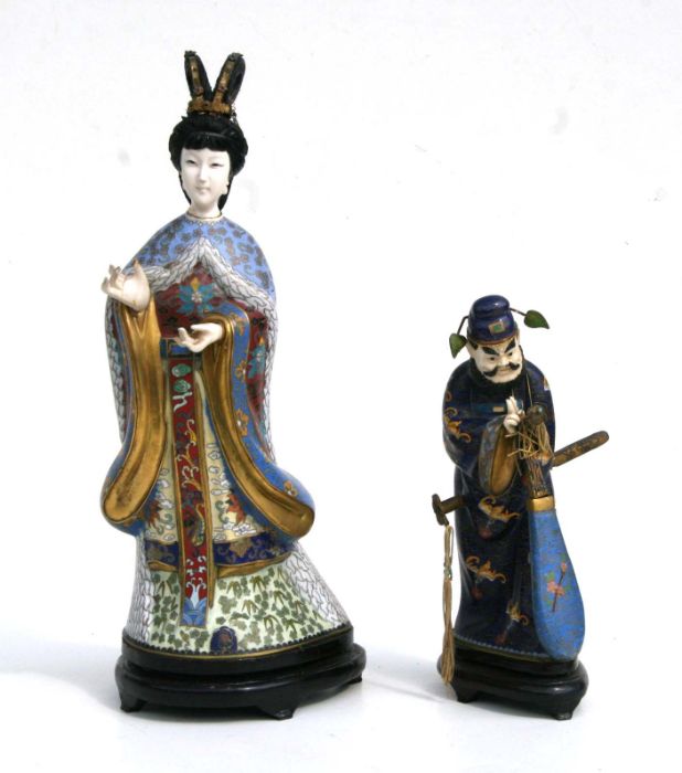 An early 20th century Chinese cloisonne figure of a robed woman with simulated ivory face and hands,