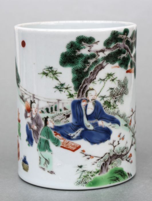 A Chinese Bitong / brush washer decorated with figures in a landscape and calligraphy, 13cms high.