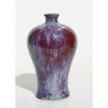 A Chinese Jun ware Meiping vase, 15cm high. Condition ReportSmall losses and chip to the glaze to