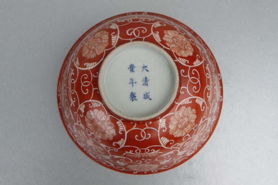 A Chinese footed bowl decorated with scrolling flowering foliage on a burnt orange ground, six - Image 4 of 7