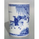 A Chinese blue and white bitong/brush pot decorated figures in a landscape, 14cm high