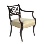 A Regency painted open arm or desk chair, the structure with traces of original paint, pierced