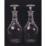 A pair of Georgian cut glass decanters, 29cms high (2).Condition ReportThere are chips to the ends