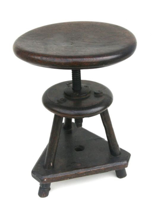 A mid century industrial machinist stool with screw rise-and-fall, 30cms diameter.