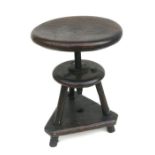 A mid century industrial machinist stool with screw rise-and-fall, 30cms diameter.
