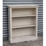 An Edwardian painted pine open bookcase with adjustable shelves, 92cms wide.