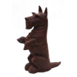 A cast iron doorstop in the form of a Scottie dog sitting on its hind legs, 43cms high (a/f).