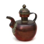 A Tibetan brass & copper butter tea pot, 28cms high.