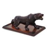 A Japanese style bronzed study of a prowling tiger, 35cms long.