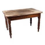 A Victorian scrubbed pine top kitchen table with plain frieze, on ring turned legs, 120cms wide.