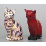 A Royal Doulton flambé figure of a seated cat, 12cms high; together with a Royal Crown Derby