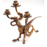 A 19th century gilt bronze three branch candelabrum in the form of a griffin. 29cm high