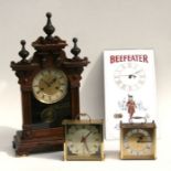 A late 19th century walnut cased mantle clock; together with a Beefeater Gin mirrored wall clock;