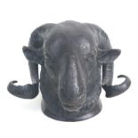 A reproduction wall mounted bronze study of a rams head, 20cms wide.