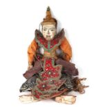 A large Burmese puppet with glass eyes and talking mouth, in traditional costume, approx 64cms