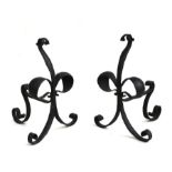 A pair of Arts & Crafts wrought iron fire dogs, 40cms high (2).